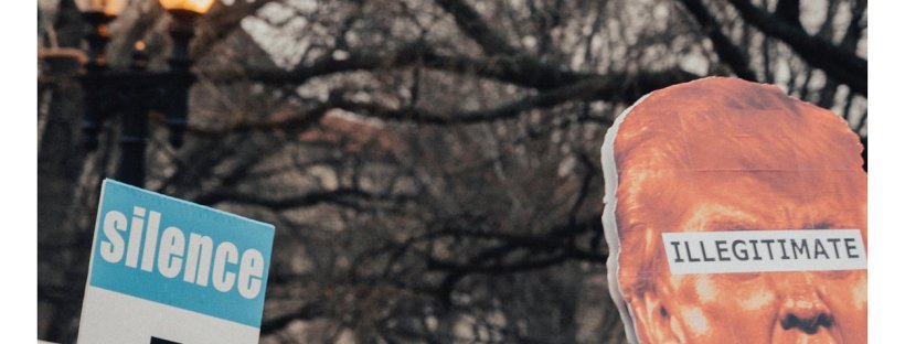 Picture of front cover of Australian Poetry Journal 8.2. The front cover features a photo of an anti-Trump protest with someone holding a sign saying 'silence =' and another sign with Trump's face and the word 'illegitimate' written across his eyes.