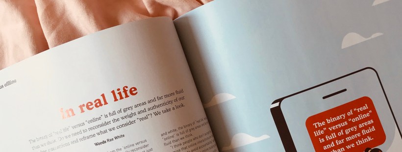 Photo of a magazine spread titled 'in real life' on a light pink background